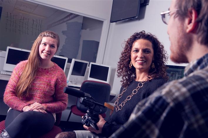 Academic Affairs staff chat in their office