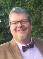 Bellarmine University Music professor Dr. Tim Glasscock poses for a portrait.