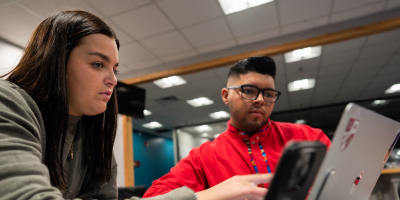 students work on their laptops