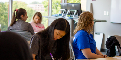student studies at her table