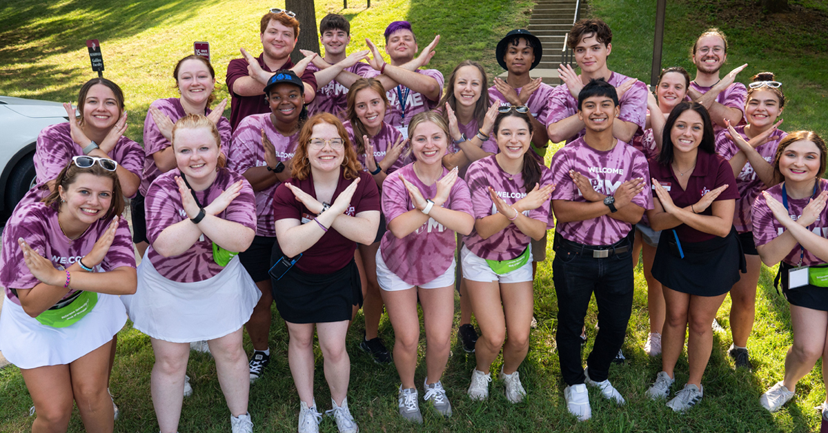 a group of students standing outside 