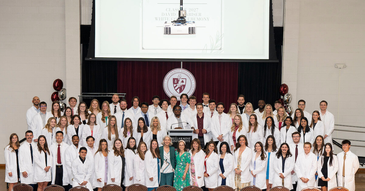 a large group of people posing for a photo