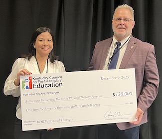 Dr. Brosky is presented a ceremonial check