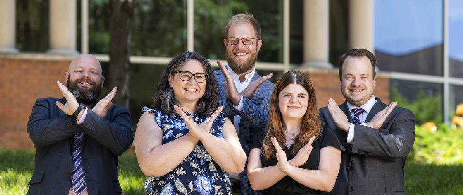 Residence leaders show their bellarmine swords up gesture