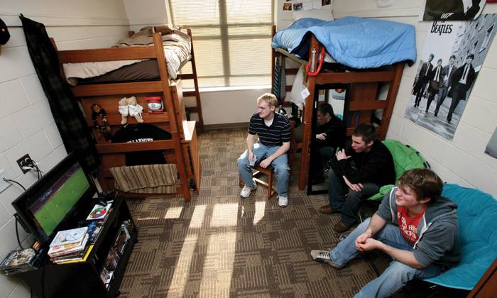 students play video games in their room