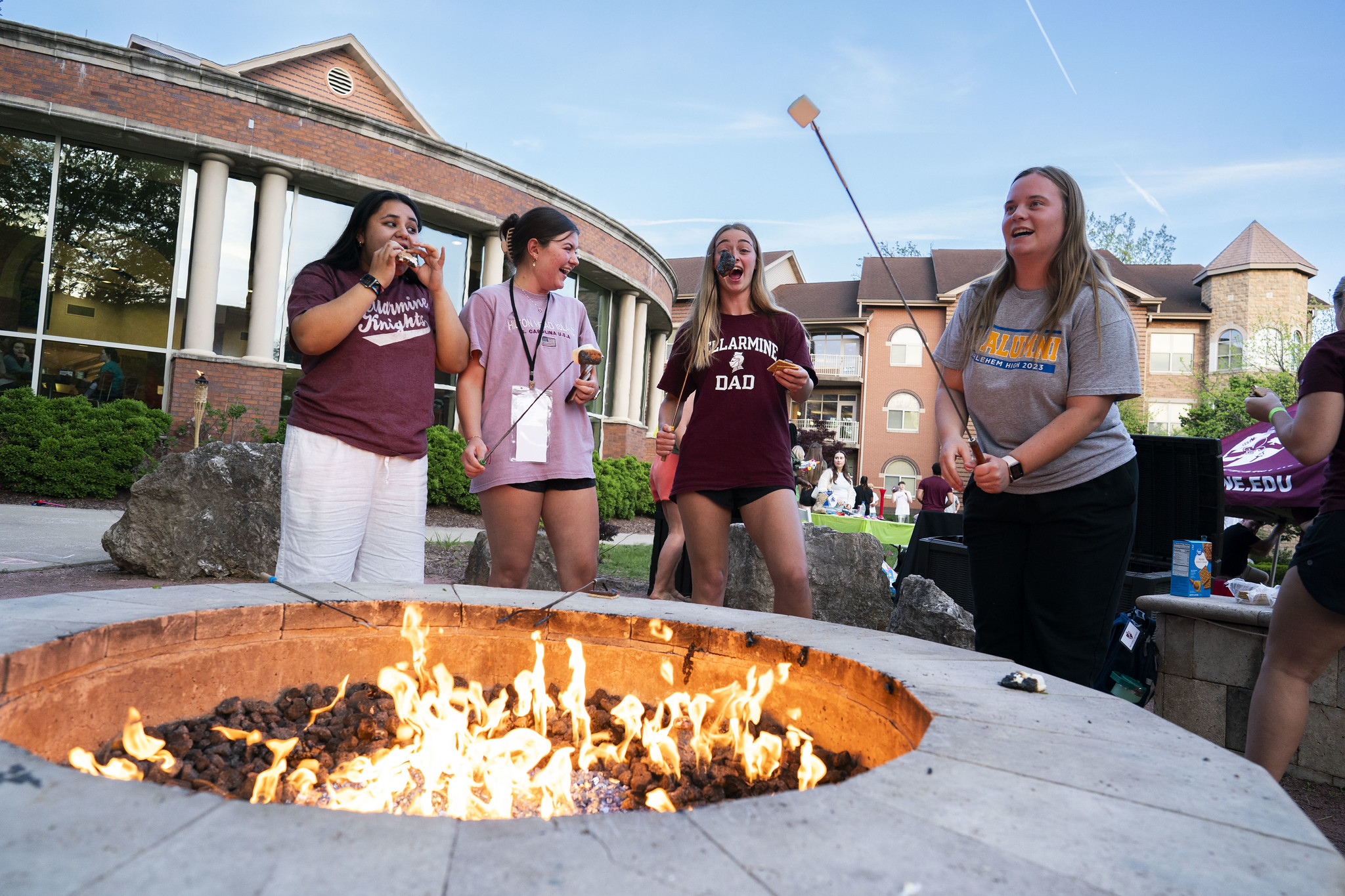 Students by the firepit Students by the firepit