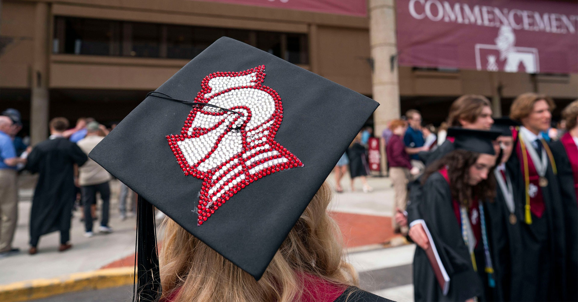 Graduate wearing cap with Knight Head art