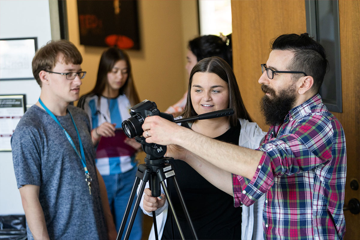 Media prrofessor with students