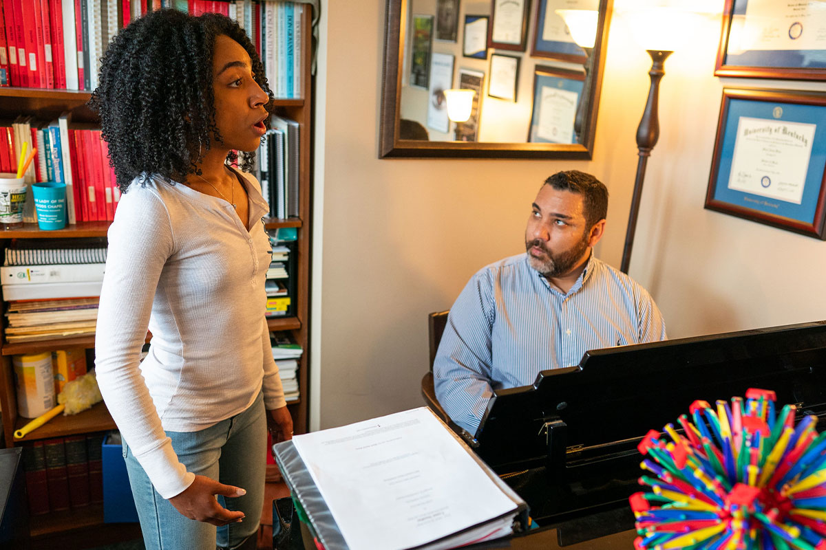 mark kano and student singing